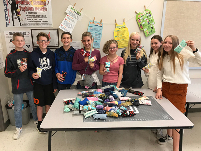 Orion Jr High students make seatbelt covers
