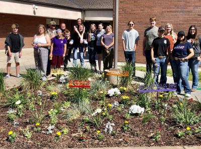Fremont Greenhouse class beautifying Farr West Elementary.