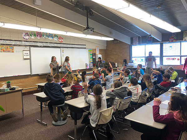 Weber students meeting with elementary students.