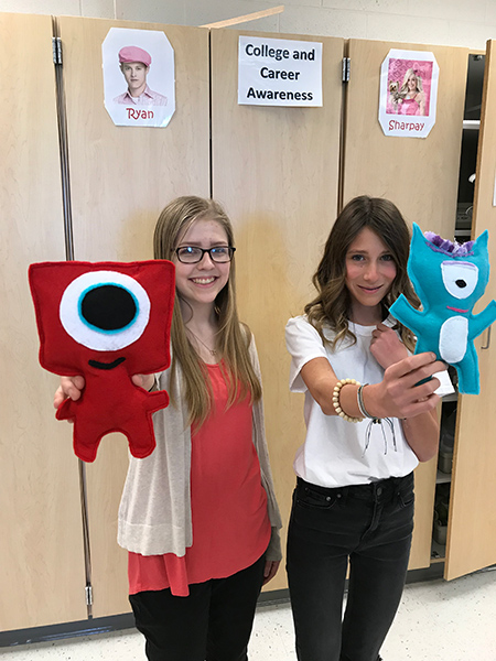 Two FACS Students show stuffed animal projects