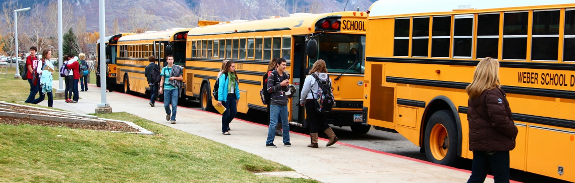 Kids loading onto school bus