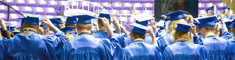Students standing to move tassel at graduation