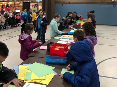 Midland Elementary students take time at lunch to create encouraging notes for residents in a local assisting living care center
