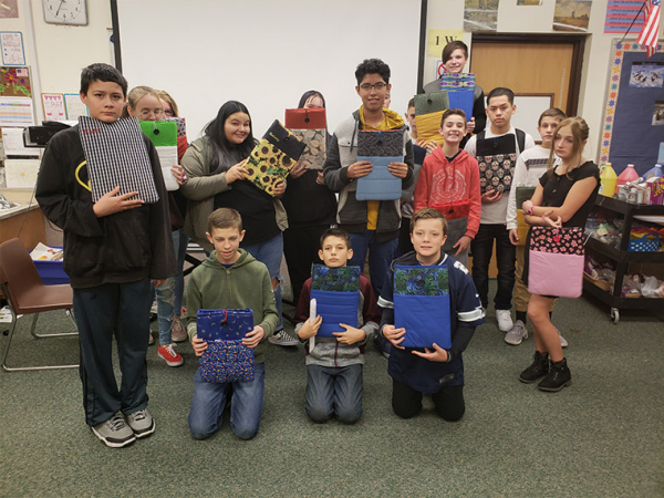 T.H. Bell students worked hard sewing chrome books covers